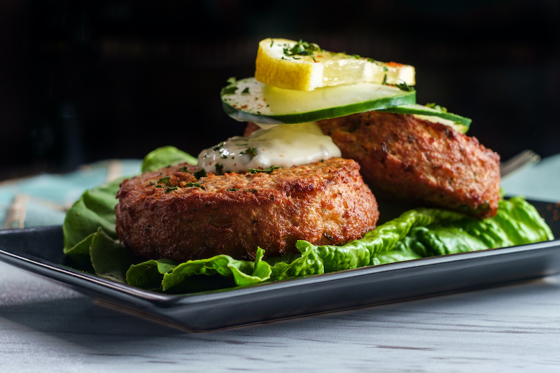 Mardi Gras seafood featuring crab cakes with lemon.