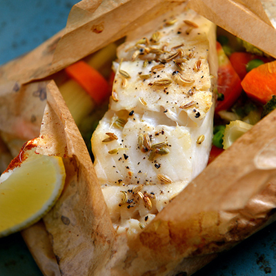 Copper River Seafoods fish cooked in parchment paper with vegetables